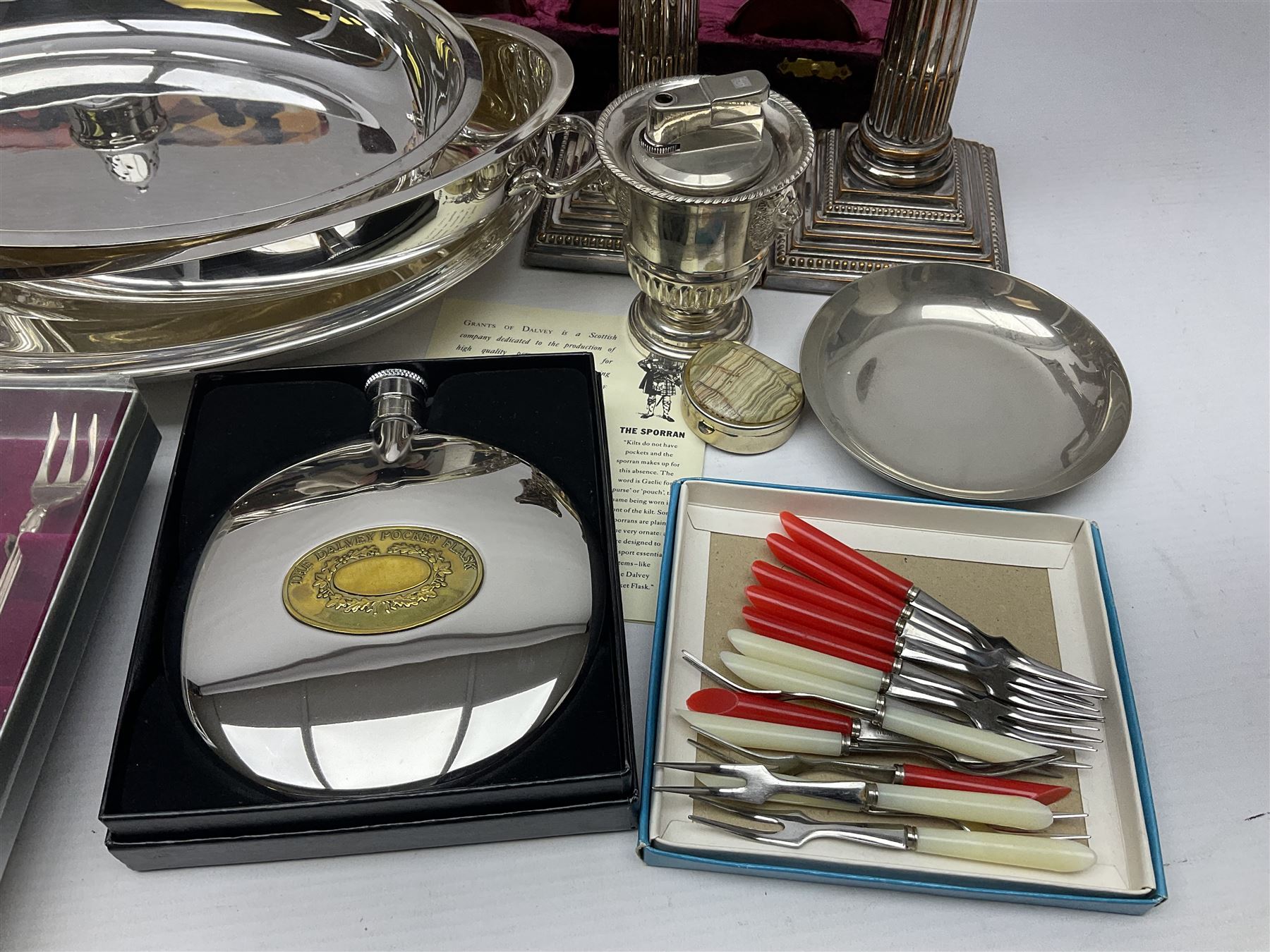 Silver plated Calibri lighter, in the form of a twin handled vase with mask handles, together with a pair of silver plated candle sticks, horn handled carving set with hallmarked silver ferrules and other silver plated items