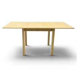 Contemporary light oak extending dining table, the square top with pull-out and fold-over action, raised on square supports