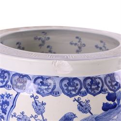 20th century blue and white fishbowl planter, decorated with birds in blossoming branches, internally decorated with goldfish, upon a wooden base, H44cm