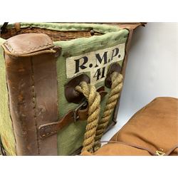 WW2 British Army RAMC 'Regimental Medical Pannier', well marked externally and dated 1941, stamped May 1943 internally, canvas covered wicker form with leather edges, hinged top and fall front with two rope carrying handles, fitted iron locking straps with securing chains; contains various unused field dressings and bandages with WW2 dates and two pillows; original label under lid L79cm