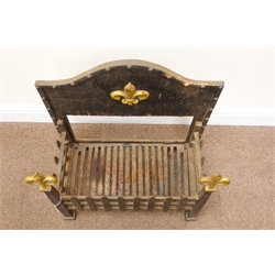  Cast iron fire dog grate, raised shaped back panel, Fleur-de-lys finials, W57cm, H61cm, D31cm  