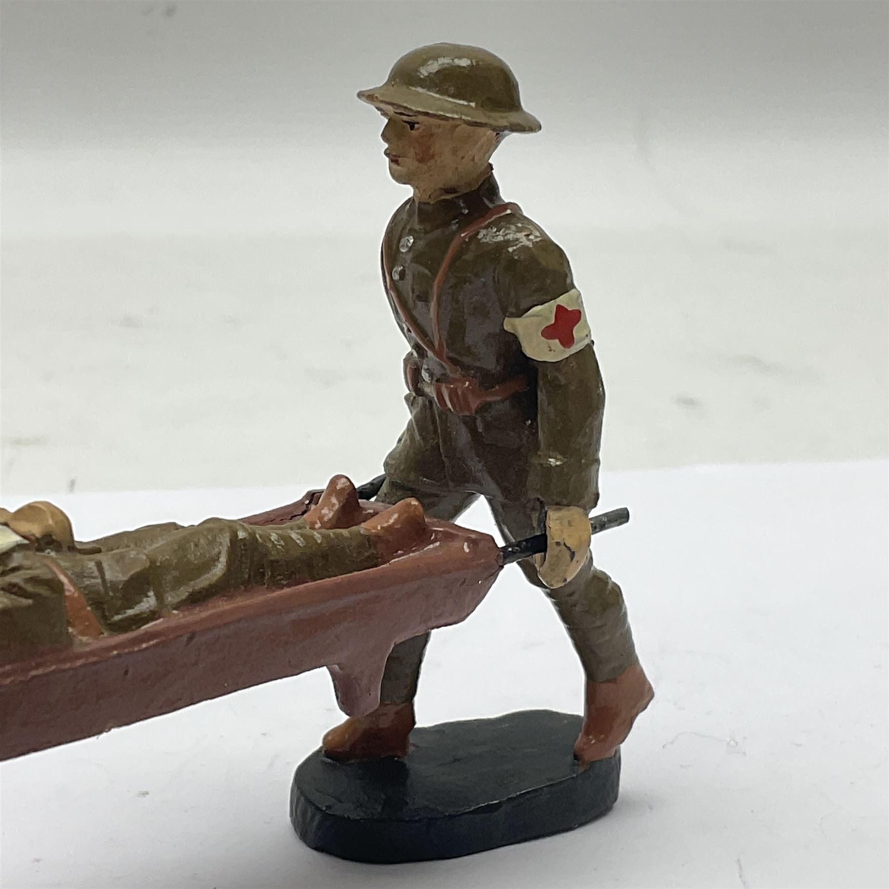 Eight Elastolin British soldiers and wartime figures, including nurse, injured soldier on stretcher, soldier with dog, etc, tallest 11cm