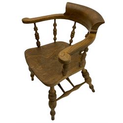 Victorian elm smoker's bow elbow chair, the arms and back raised on turned spindle balustrade, turned supports joined by double H stretchers, figured and dished seat