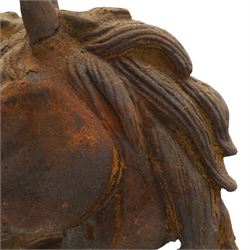 Pair of antique cast iron garden finials or statues of horse heads or busts, the heads with flowing and pierced mane, mounted on spherical finials over square tapering bases