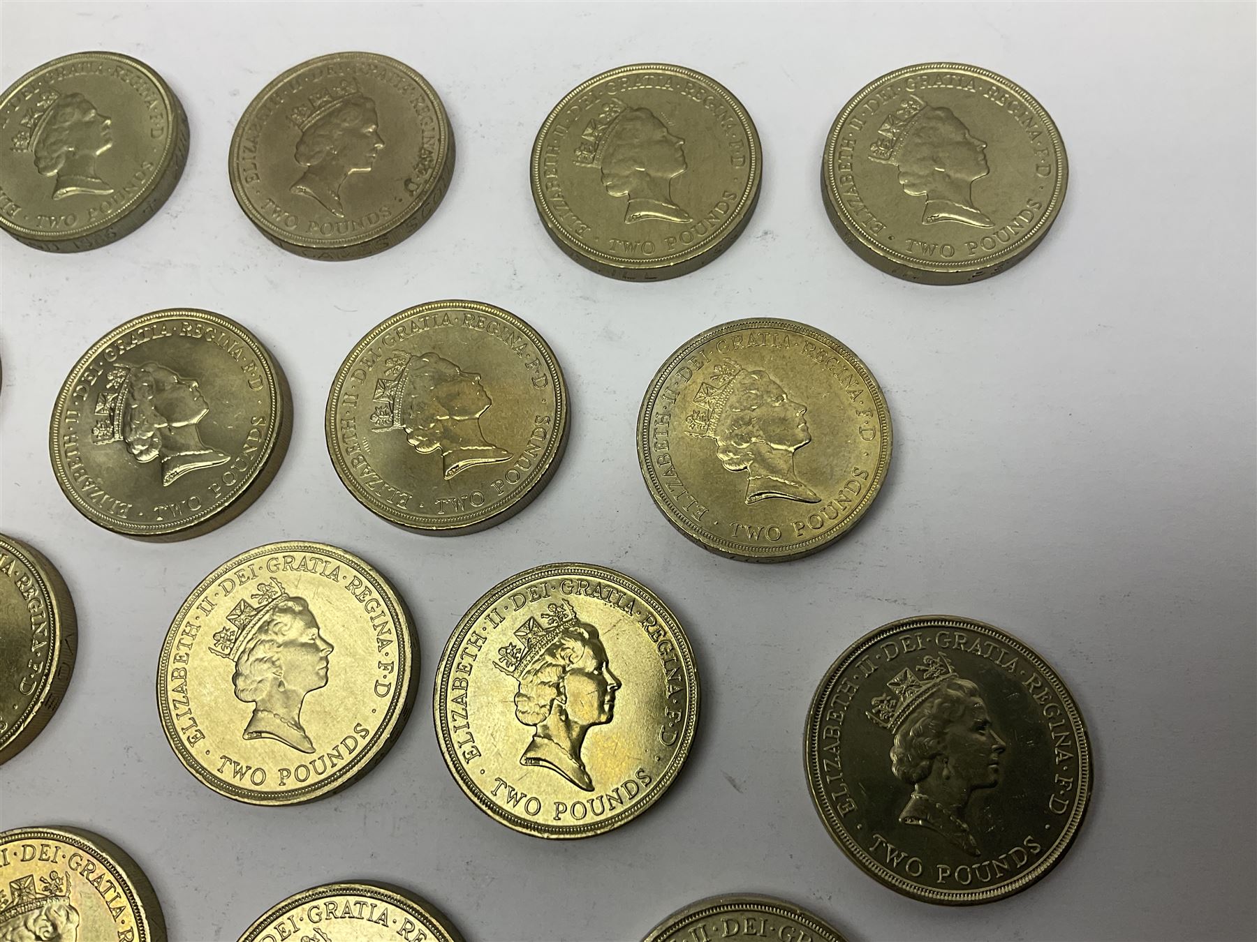 Twenty-eight Queen Elizabeth II old style two pound coins, including 1994 'Bank of England' etc