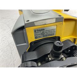 Trimble land surveying equipment - 5000 Series 5603 DR300+ Robotic Reflectorless Total Station, serial no.84310406; in carrying case; together with GPS Holder 58317019, serial no.95320184; ACU 571225500, serial no.83214786; Docking Station 58252019, serial no.95823458 with Power Supply; RMT 606 Remote Target on pole with CU Holder and External Georadio 2.4GHz; cased Power Pack Kit; folding tripod; and aluminium 5m telescopic measuring staff