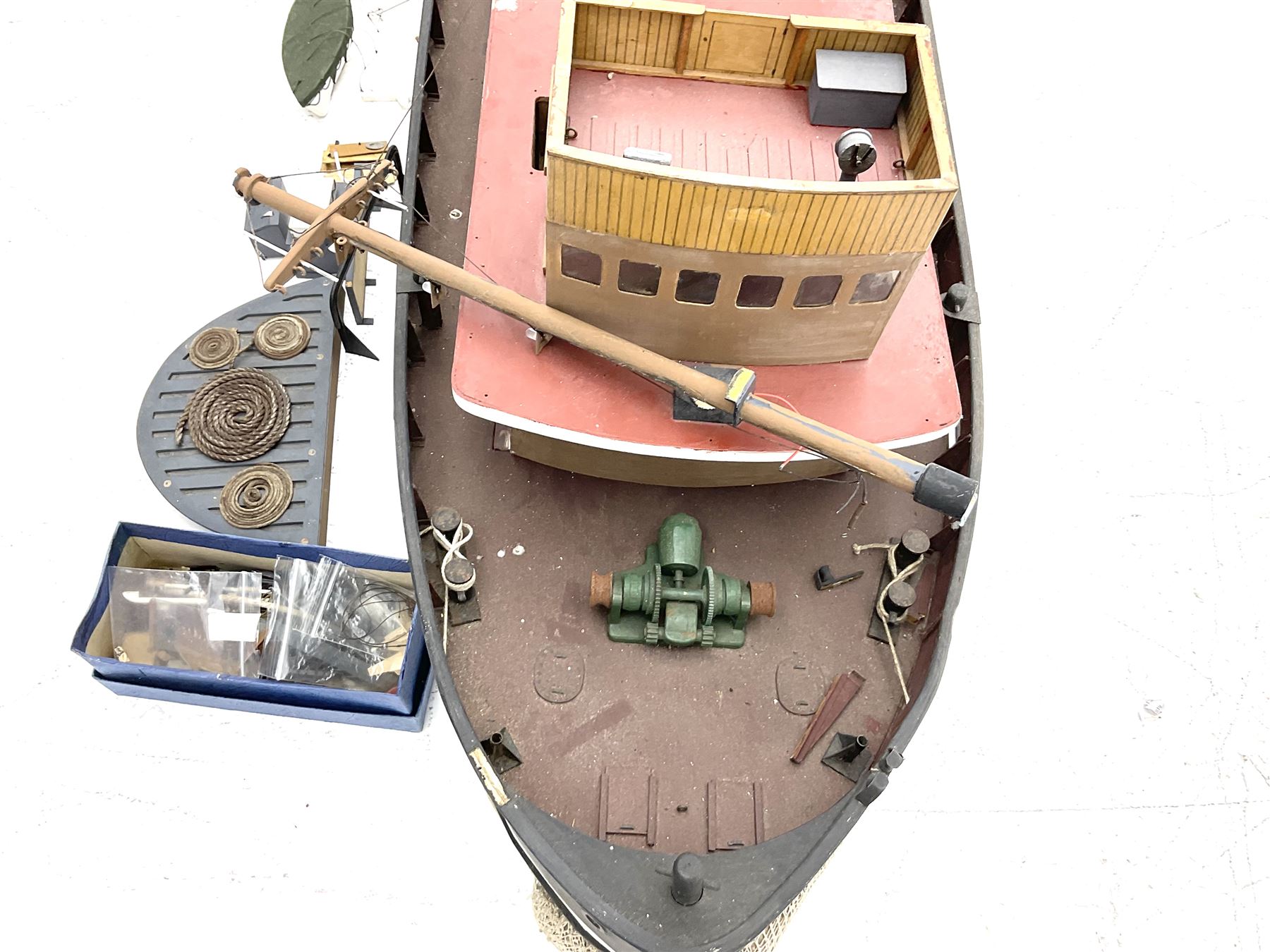 Large model of the tugboat 'Dhulia' on a wooden stand L144cm, together with a box of additional parts and plans