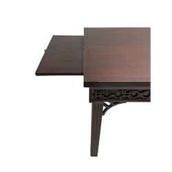 In the manner of Thomas Chippendale - early 19th century mahogany serving table, rectangular crossbanded top with boxwood stringing, the frieze with upper moulding over applied geometric fretwork, the left-hand side fitted with slide, on fluted square supports with inner chamfer 