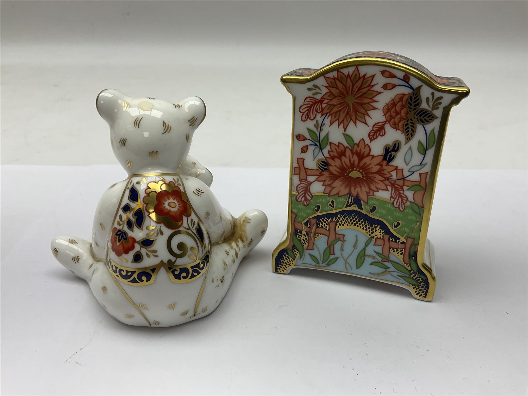 Royal Crown Derby Haiku pattern miniature clock, together with 1128 Imari pattern trinket box with cover and teddy bear figure, all with printed marks beneath   