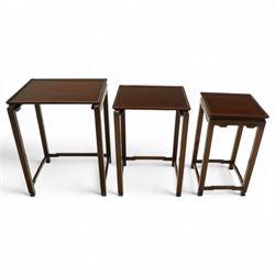 Whytock & Reid, Edinburgh  - Edwardian nest of three Chinese-style solid mahogany occasional tables, rectangular top with finely moulded edge above slim square section legs with subtly chamfered inner edges, joined by H-shaped stretchers, largest W40xD33xH52cm