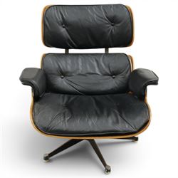 Charles and Ray Eames for Herman Miller - lounge chair, moulded veneered plywood shell with buttoned black leather upholstery, separate headrest and back cushions, padded armrests, on black cast aluminium five-star swivel base, manufactured under licence by Hille of London