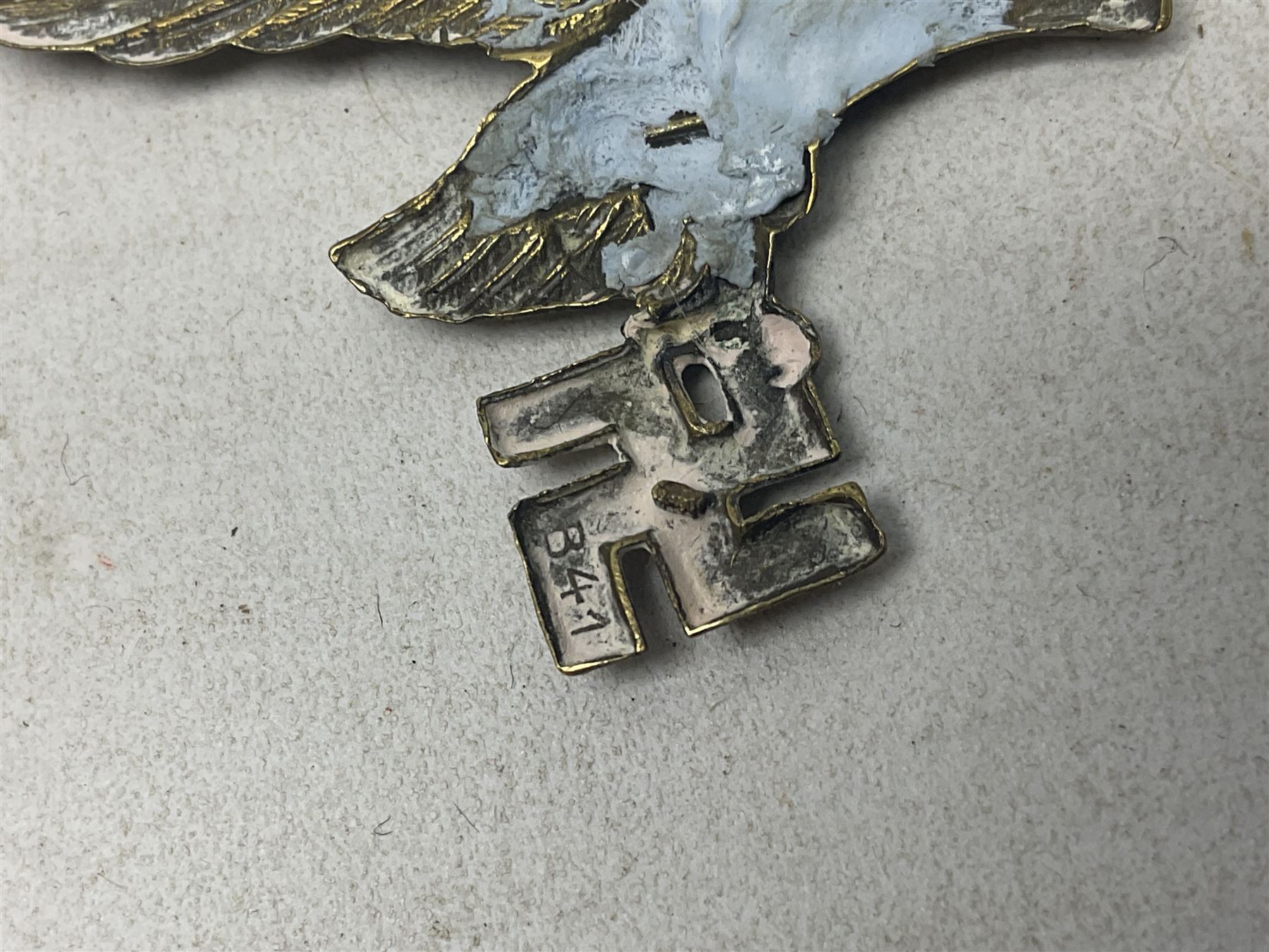 Imperial German Prussian Army Service Veterens Association badge; 'SS' type first pattern cap skull; Luftwaffe metal eagle uniform insignia; and another metal eagle cap insignia (possibly police?) (4)