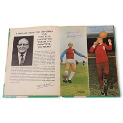 'World Cup 1966 England' hardback book, signed to inner front page by thirteen legendary footballers, to include Bobby Moore, Pele, George Cohen, Bobby Charlton, Alan Ball, Nobby Stiles, Roger Hunt, Peter Thompson, Kenneth Wolstenholme, Jairzinho, Garrincha, Martin Peters and Geoff Hurst, with certificate of authenticity from Chaucer Auctions