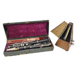 Early 20th century Hawkes and Son simple system hardwood clarinet serial no.1HM257102; cased; and a Swiss Maelzel BS Dulcet metronome of typical pyramid form (2)
