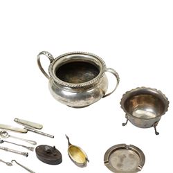 Silver sugar bowl, engine turned silver ashtray, silver napkin ring, silver backed mirror, two silver bladed and mother of pearl fruit knives etc