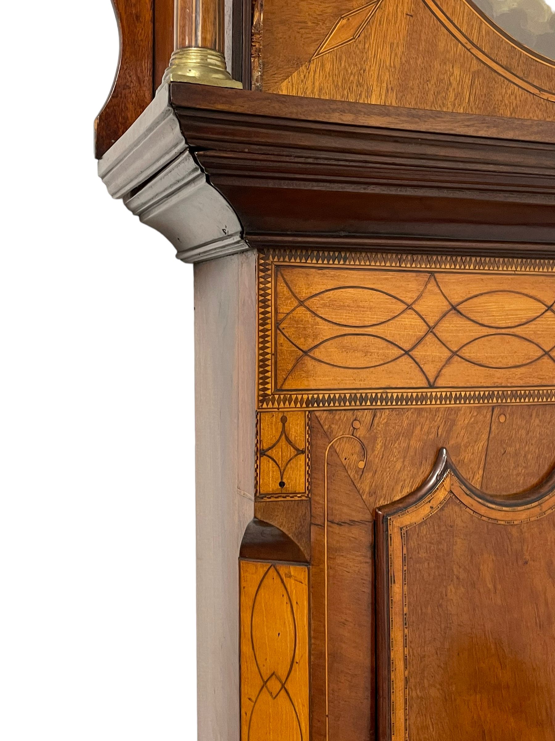 John Stonehouse of Leeds - mahogany 8-day longcase clock with a painted oval dial c1830, hood with a swans necked pediment and profuse contrasting inlay to both the hood and case, oval hood door with flanking pilasters and Corinthian capitals, conforming case with canted corners and short triple spire door, broad plinth with matching inlay and canted corners on shallow base, dial depicting masonic regalia, symbols, and pictorial depictions of the humanities, faith, hope, charity and righteousness, black chapter with white roman Arabic’s, date recorder and matching “crown” hands, dial pinned to a rack striking movement with a recoil anchor escapement, striking the hours on a coiled underslung gong. With weights and gridiron pendulum. 
This clock case is of large, impressive dimensions and was almost certainly commissioned for a large masonic lodge in Leeds, a rare and unique example.