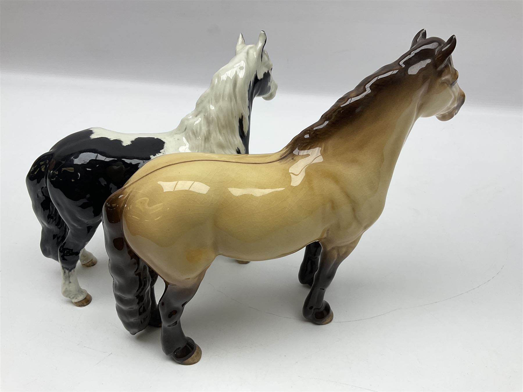 Beswick dun Highland pony no 1644 and piebald Pinto Pony  no 1373, both with printed mark beneath