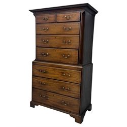 George III mahogany chest on chest, the upper section with two short over three long drawers with swan neck handles flanked by canted corners, inlaid with boxwood stringing below a dentil cornice. The lower section with three long drawers, supported on bracket feet 