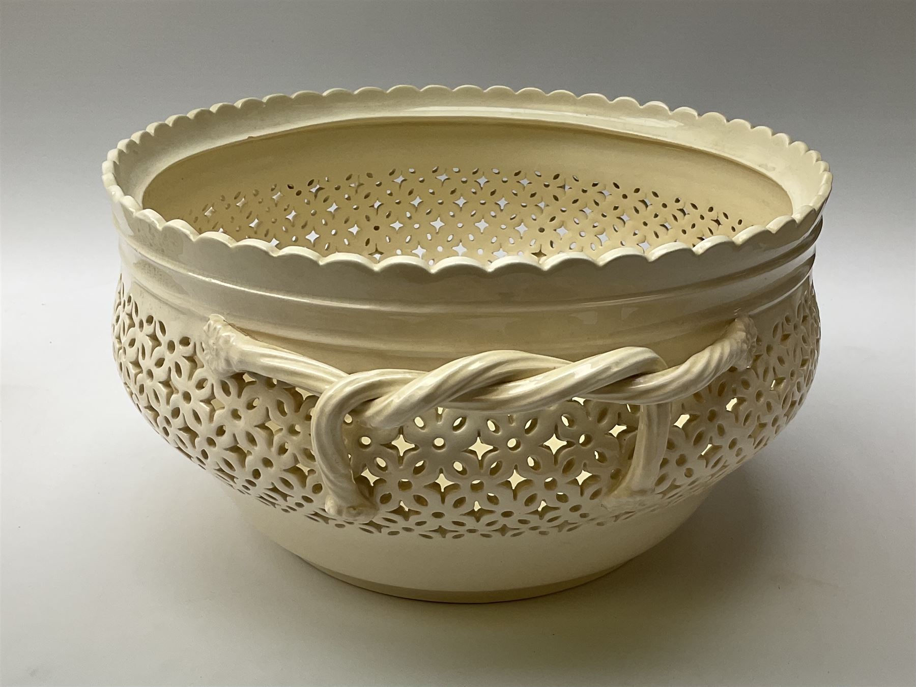 Large 20th century Leeds pottery basket and cover, of bulbous form with pierced detail and twin rope handle, with impressed mark beneath, H23cm D25cm