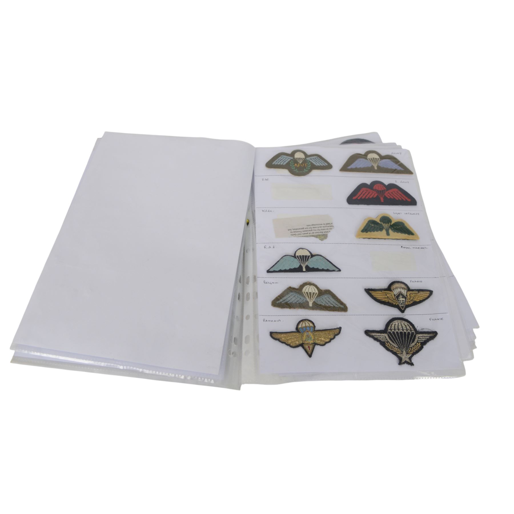 Collection of British cloth insignias, including RAF, Royal Navy/Marine and Parachutist examples 
