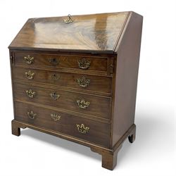 George III mahogany bureau, fall-front enclosing a fitted interior of drawers, pigeonholes and central mirrored cupboard, over four graduated cockbeaded drawers with brass batwing handles, raised on bracket feet