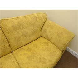  Marks and Spencer's three seat sofa upholstered in a floral patterned gold fabric, W225cm  