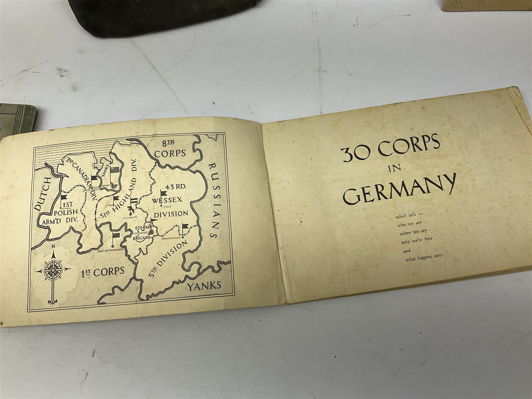 WW2 German War Pass (Wehrpass) identification paperwork for Walter Fensterseifer 2nd type booklet dated 8/6/1940, with signed photo of recipient in civilian suit. Born 31st January 1921. Numerous entries; together with quantity of small private photographs of German soldiers; One Million mark banknote 1923; 30th Corps in Germany booklet with Formation badge; and other WW2 paper ephemera