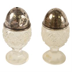George III silver open salt with embossed floral decoration and a pair of cut glass cruets with silver lids, all hallmarked