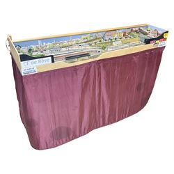 'Z' gauge continental scenic layout with folding legs, various loops of track and sidings with overhead cables, buildings including water tower, tunnels, roads with motor vehicles and figures, trees, haven with boats, backdrop diving wall hiding control units 150 x 50cm