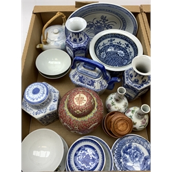 A group of assorted Oriental and Oriental style ceramics, to include a blue and white ginger jar and cover, a blue and white vase of square sided form, plus a selection of other vases, jars, tea bowls, plates, etc. 