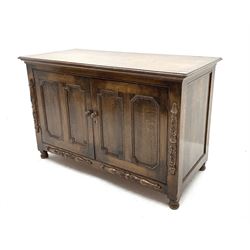 20th century oak cupboard, moulded rectangular top over two panelled doors with geometric mouldings, applied carved split turnings, on turned feet