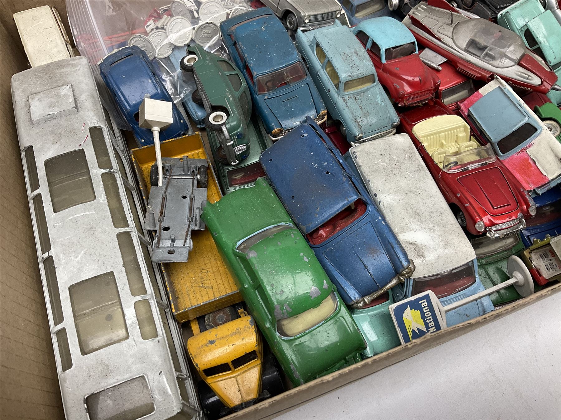 Dinky - over thirty unboxed and playworn die-cast models including Vega Major Luxury Coach, Peugeot 404, Humber Hawk, Ford Transit Van, Jaguar Type D etc; fourteen Dinky road signs; and quantity of other models including Budgie Supercar, Tri-ang Spot-On, Tekno etc