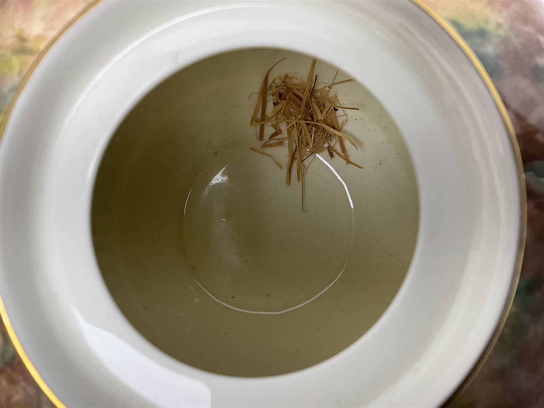 Mid 20th century Royal Worcester potpourri vase and cover decorated by Alan Telford, of ovoid form with inner cover and pierced gilt outer cover with bud finial, upon short gilt circular foot, the body part moulded with basket weave bands in gilt and bronze, and hand painted with a still life of fruit upon a mossy ground, signed Telford, with black printed mark beneath and painted shape number 1286, H25.5cm