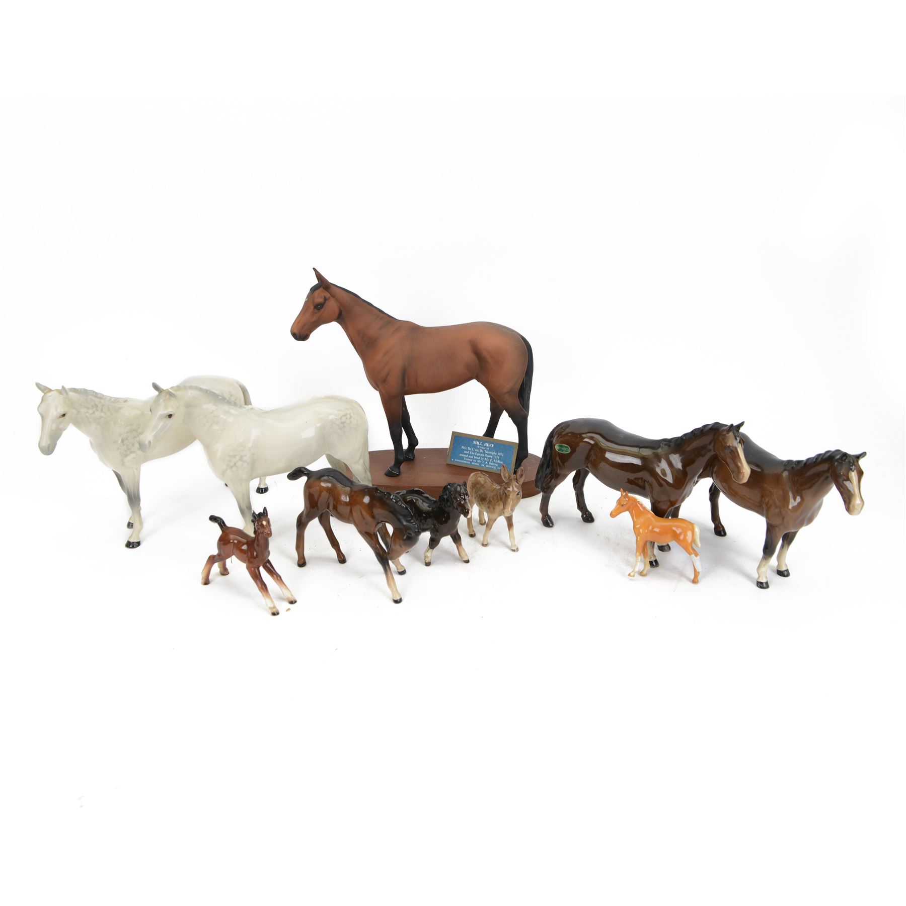 Group of Beswick horse and donkey figures, including Connoisseur Model Mill Reef, Shetland Pony no. 1034 and Bois Roussell no. 701