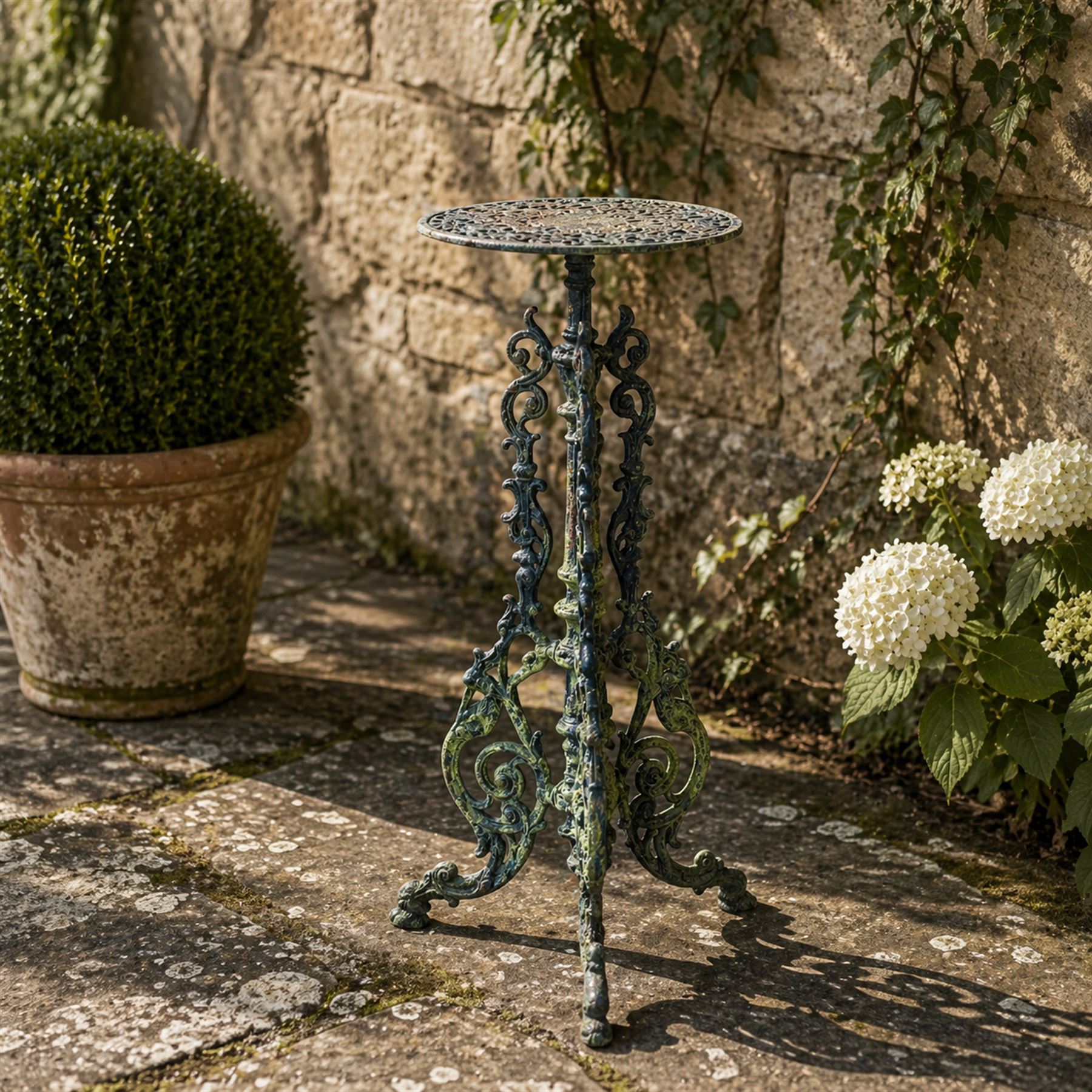 19th century ornate cast iron high garden drinks table, small circular pierced top, raised on three legged base