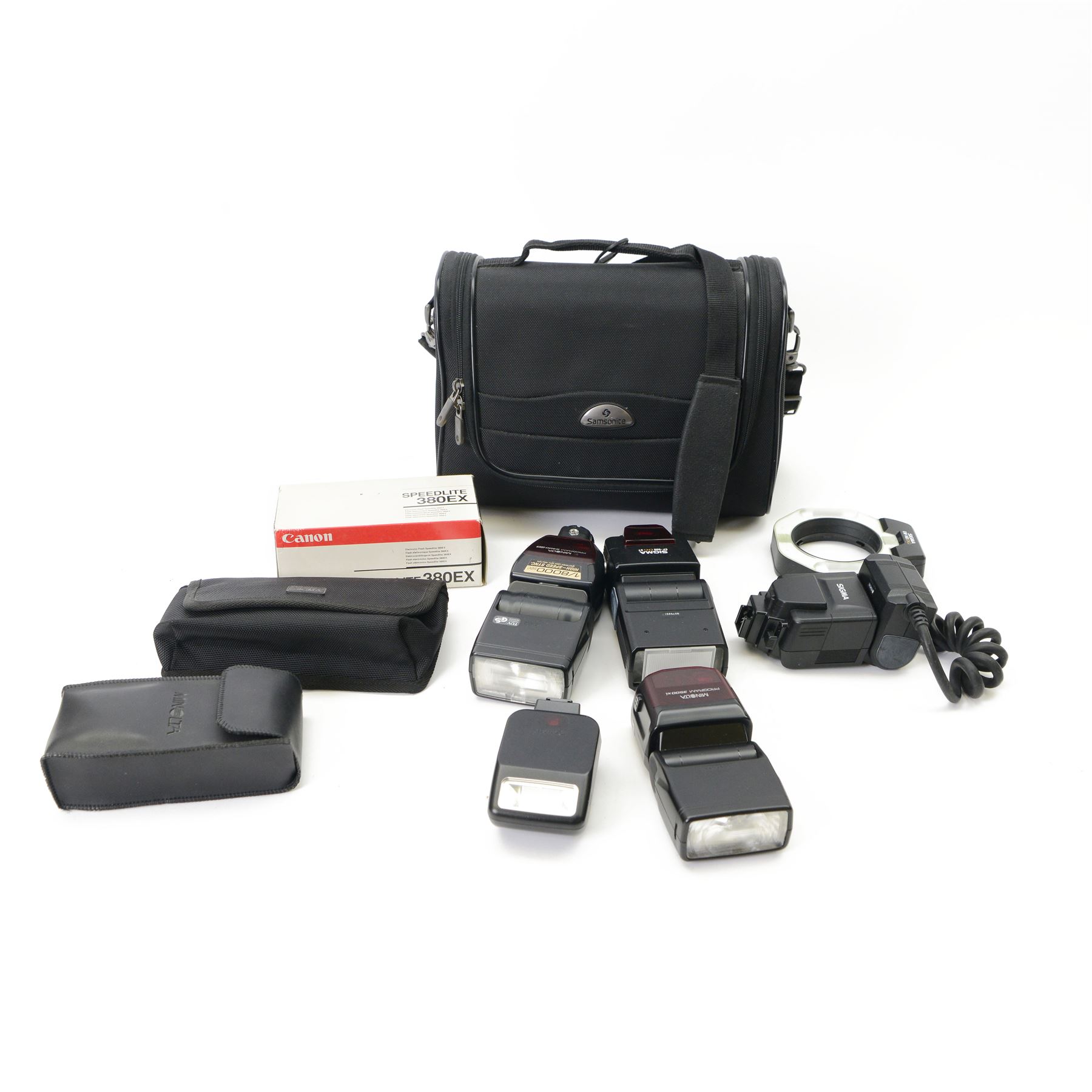 Six camera flashes, comprising Sigma EM-140 DG ring flash, Sigma EF-500 DG St, Minolta Program 5400 HS, Minolta Program 3500xi, Speedlite 200E, and a Canon Speedlite 380 EX in box, all in a Samsonite carrycase