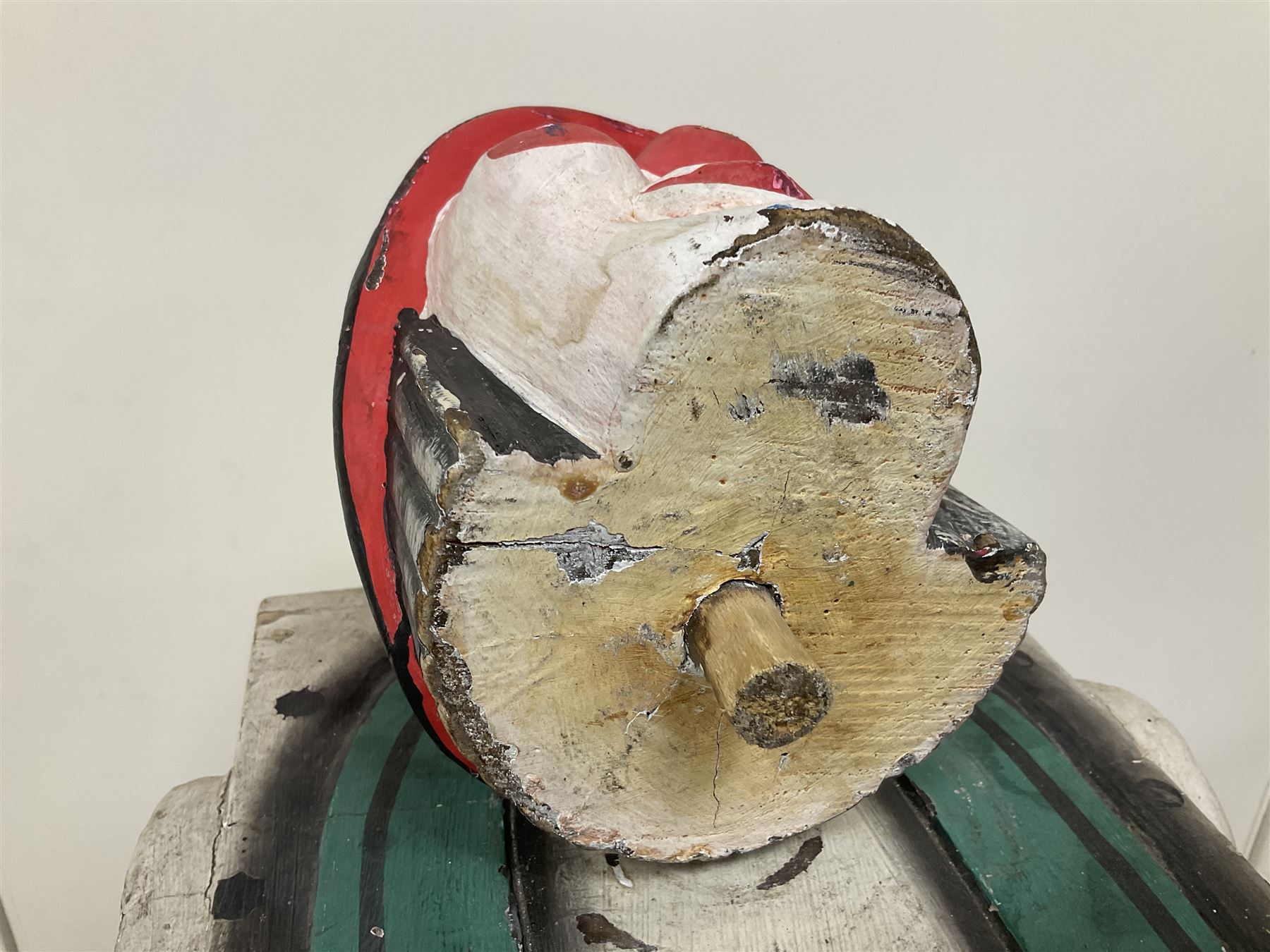 Folk art circus clown cabinet, the the two hinged doors with bow tie decoration opening to reveal fitted shelved interior, the body painted with polka dots and spades, H121cm