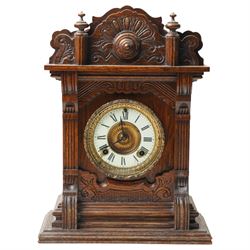 Late 19th century-8-day American Ansonia mantle clock, in a carved oak case with an enamel...