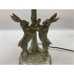 Silver composite table lamp, modelled as a pair of boxing hares, with a grey velvet shade, H45cm