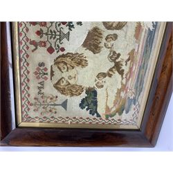 Victorian Berlin Woolwork picture, depicting a recumbent Spaniel and three puppies, along with motifs of stylised flowers and urn of flowers surmounted by two birds, indistinctly initialled MAS[?], within a strawberry vine border, in rosewood frame, overall H59cm L69cm