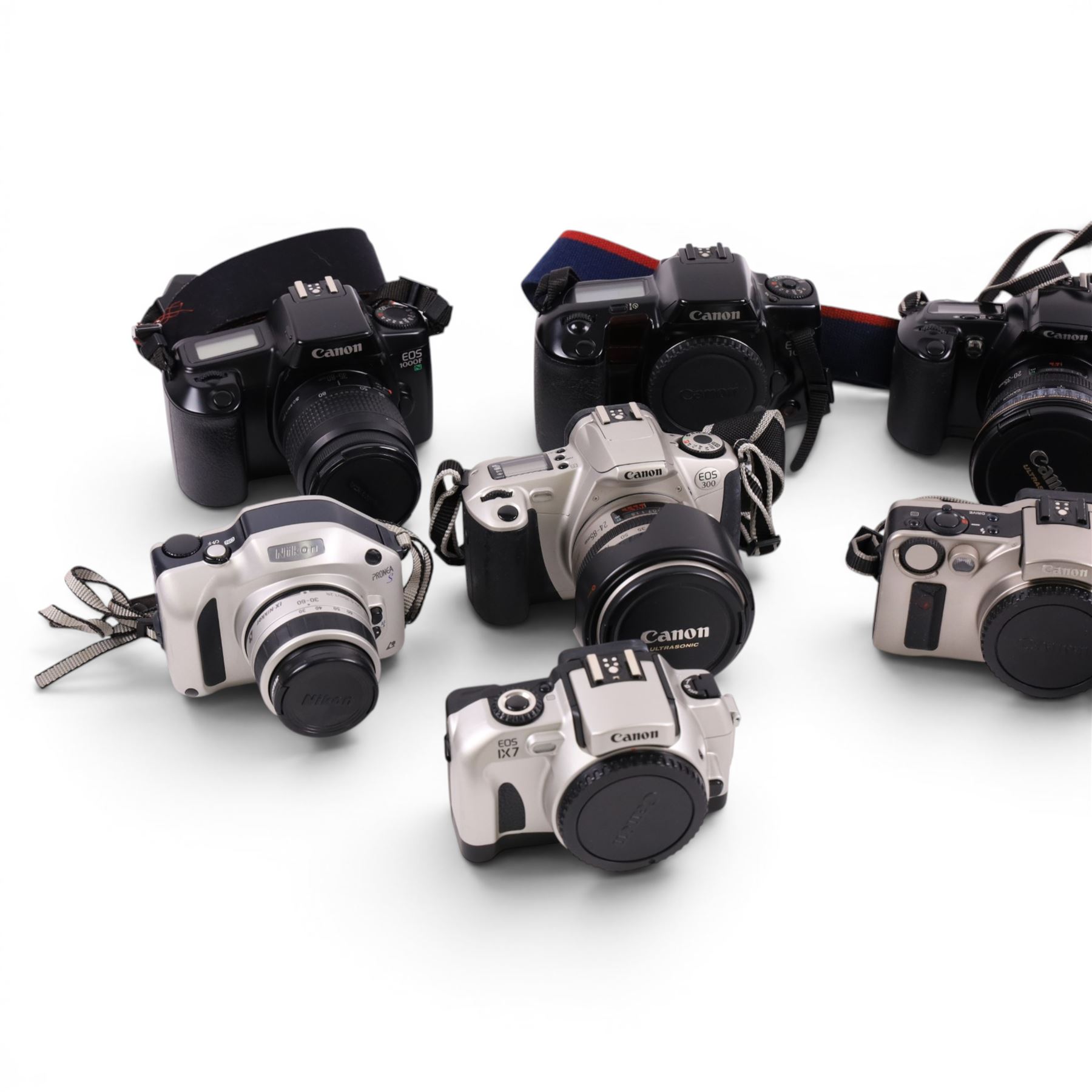 Ten digital cameras, including seven Canon EOS examples, Nikon F65, Nikon Pronea and Nikon F75