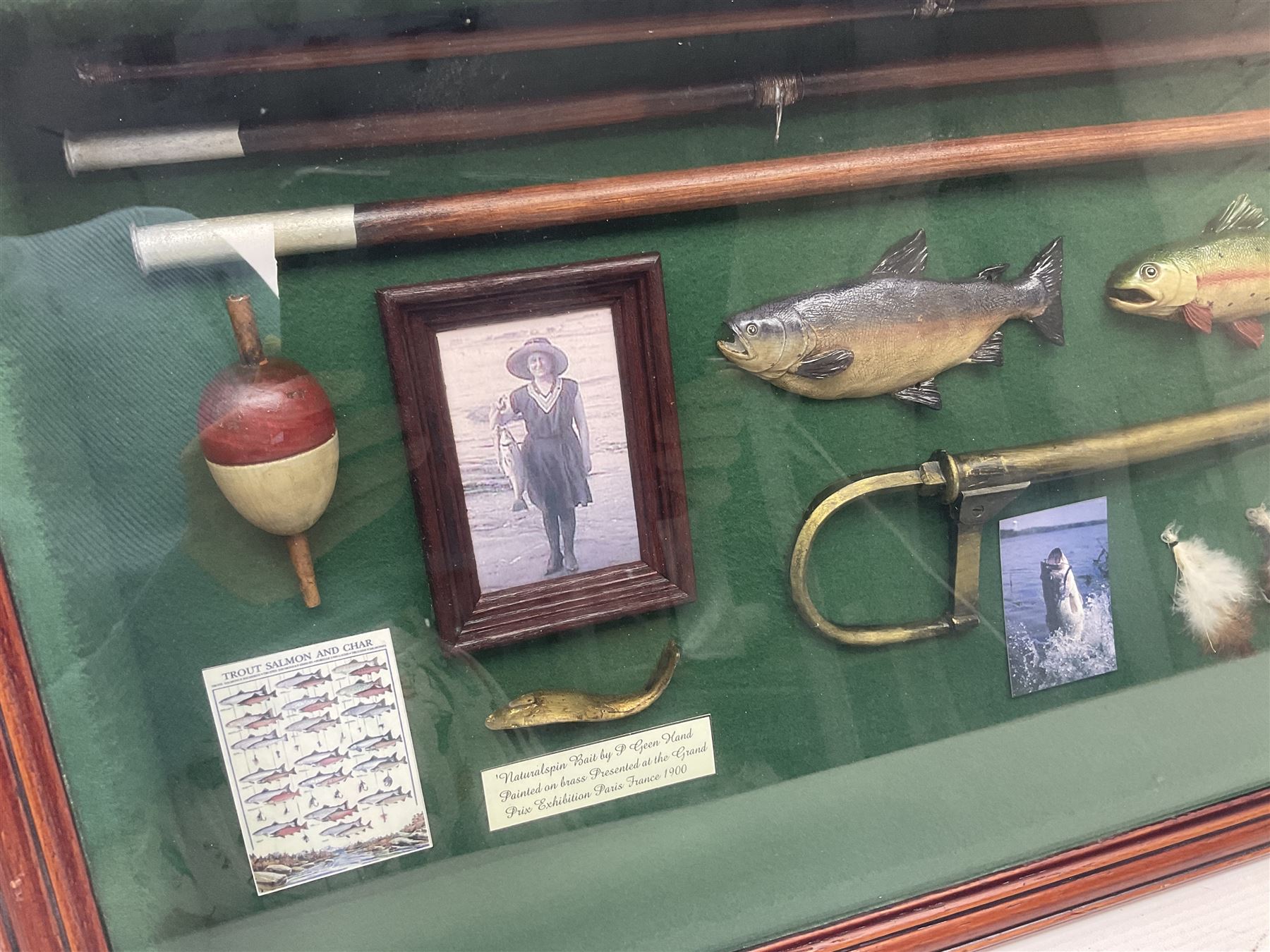 Four framed sporting memorabilia displays, the largest example containing 1930s cricket memorabilia, together with two fishing displays and a football display, each within wooden glazed frames, largest H105cm