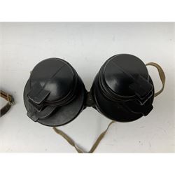 Pair of WWII German U-boat binoculars probably 7 x 50 by Leitz, with rubber eye piece protector covers and leather case stamped with Kriegsmarine mark to the lid and dated 1944, with leather strap.