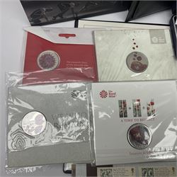 Mostly commemorative coinage, including various Queen Elizabeth II United Kingdom brilliant uncirculated fifty pence, two pound and five pound coins in card folders, The Royal Mint United Kingdom 2012 proof coin set, Alderney 2021 'Royal National Lifeboat Institution' five pound coin cover in Harrington and Byrne folder etc
