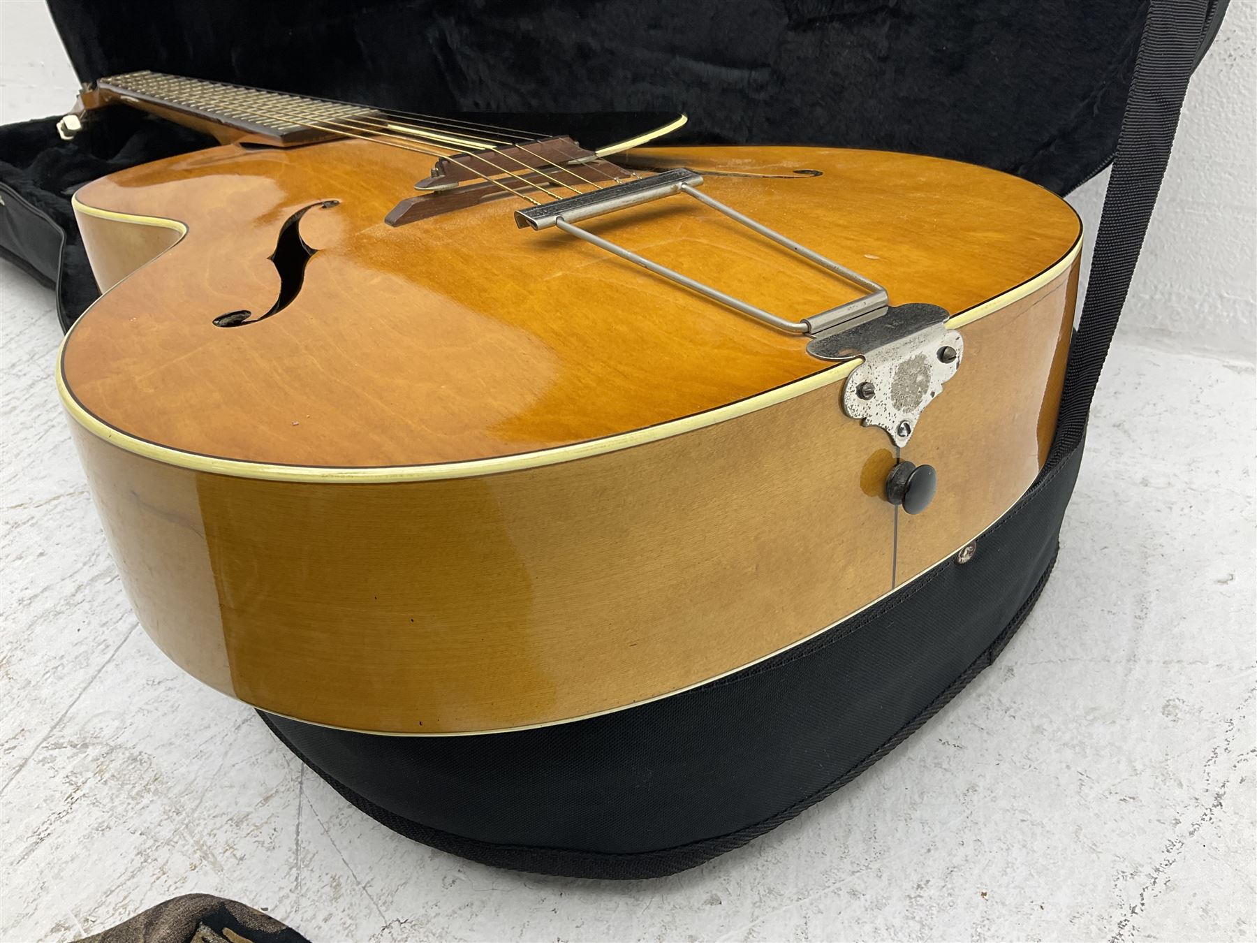 1950s acoustic guitar with f-holes and pickguard L105cm; black fur lined hard carrying case