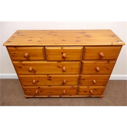  Solid pine chest, moulded top, nine drawers, bun feet, W133cm, H102cm, D43cm  