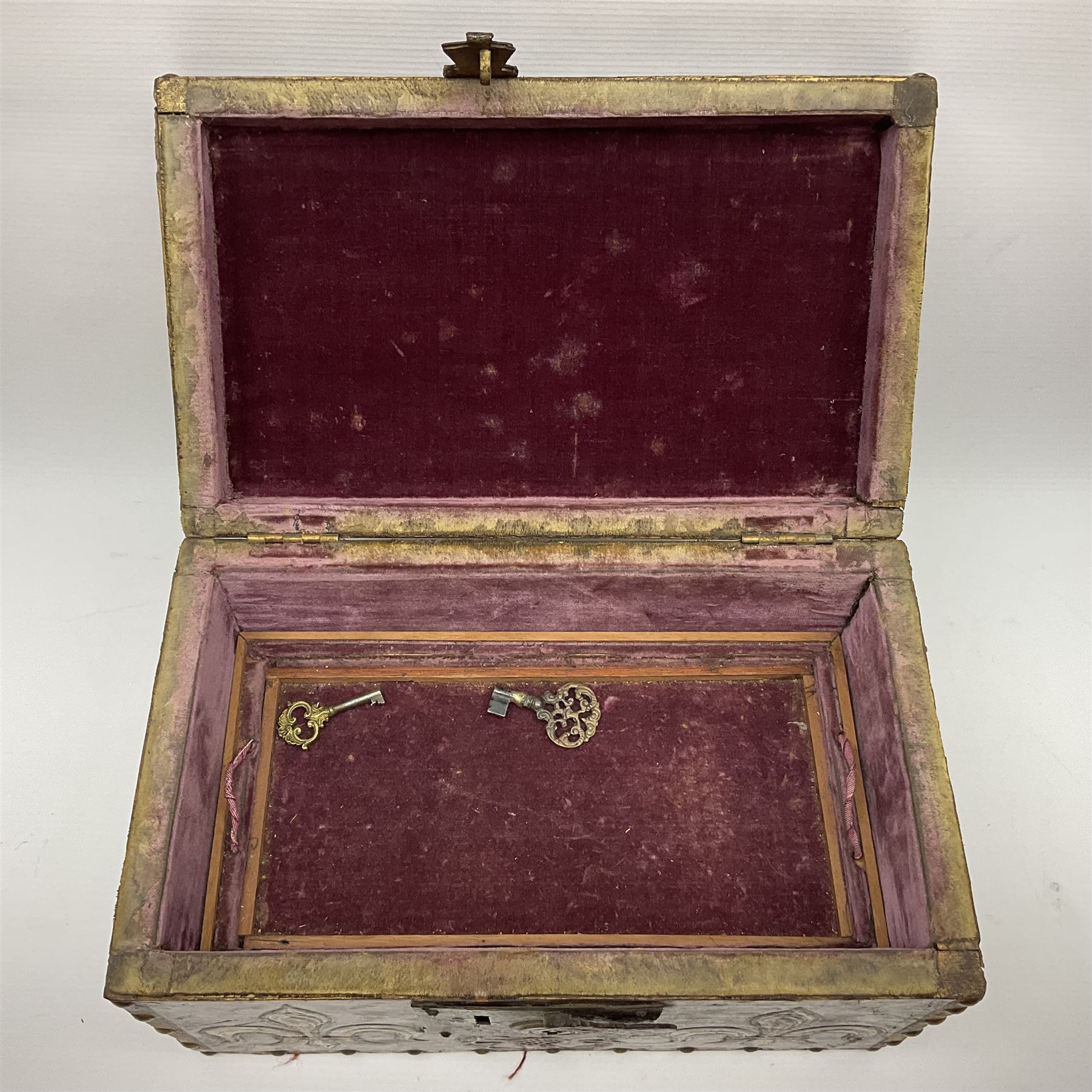 20th century box, decorated in faux leather with the royal coat of arms and GR 1719 to hinged cover, with fleur-de-lis, lion, crown and rose motifs throughout and studs to all edges, opening to reveal a purple velvet interior containing three removable wooden trays, H18.5cm