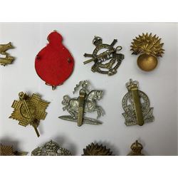 Twenty-six cap badges for Yeomanry and various guards including Fife & Forfar, Lothian and Border Horse, Leicestershire, Northamptonshire, Queens Own, Coldstream, Grenadier, Machine Gun Regiment, Life Guards etc (26)