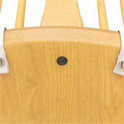 Ercol - ‘Chairmakers’ armchair, of traditional Windsor form in light ash, featuring a hoop back with four spindles and central splat, curved arms and turned supports, dished seat with upholstered blue cushion