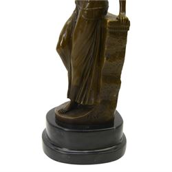 After Milo; Egyptian lady leaning on a wall with sphinx carving, upon a stepped oval base H25cm